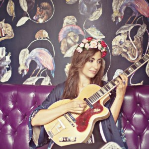 Picture of Manchester singer-songwriter Zoe Kyoti playing her guitar - Copyright Zoe Kyoti - Official Site